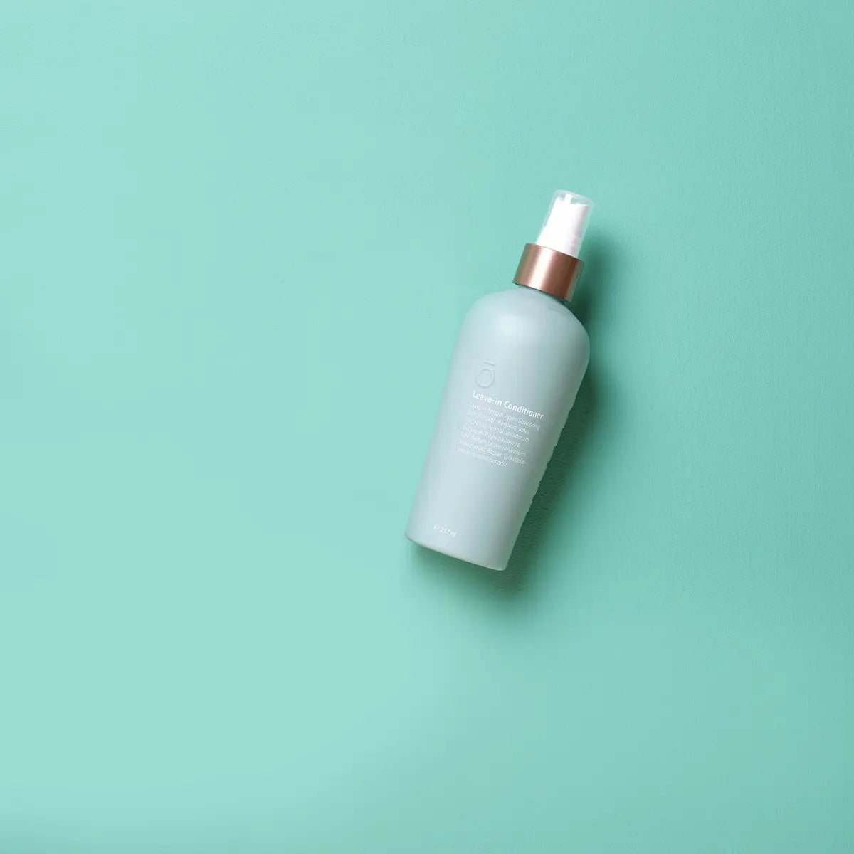Acondicionador sin aclarado dōTERRA 237ml — frasco blanco en estudio