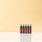 Espray purificador On Guard dōTERRA 27ml — cinco frascos en fila sobre fondo beige
