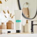 Pasta de dientes SuperMint dōTERRA 125ml — tubo en baño sobre encimera de mármol