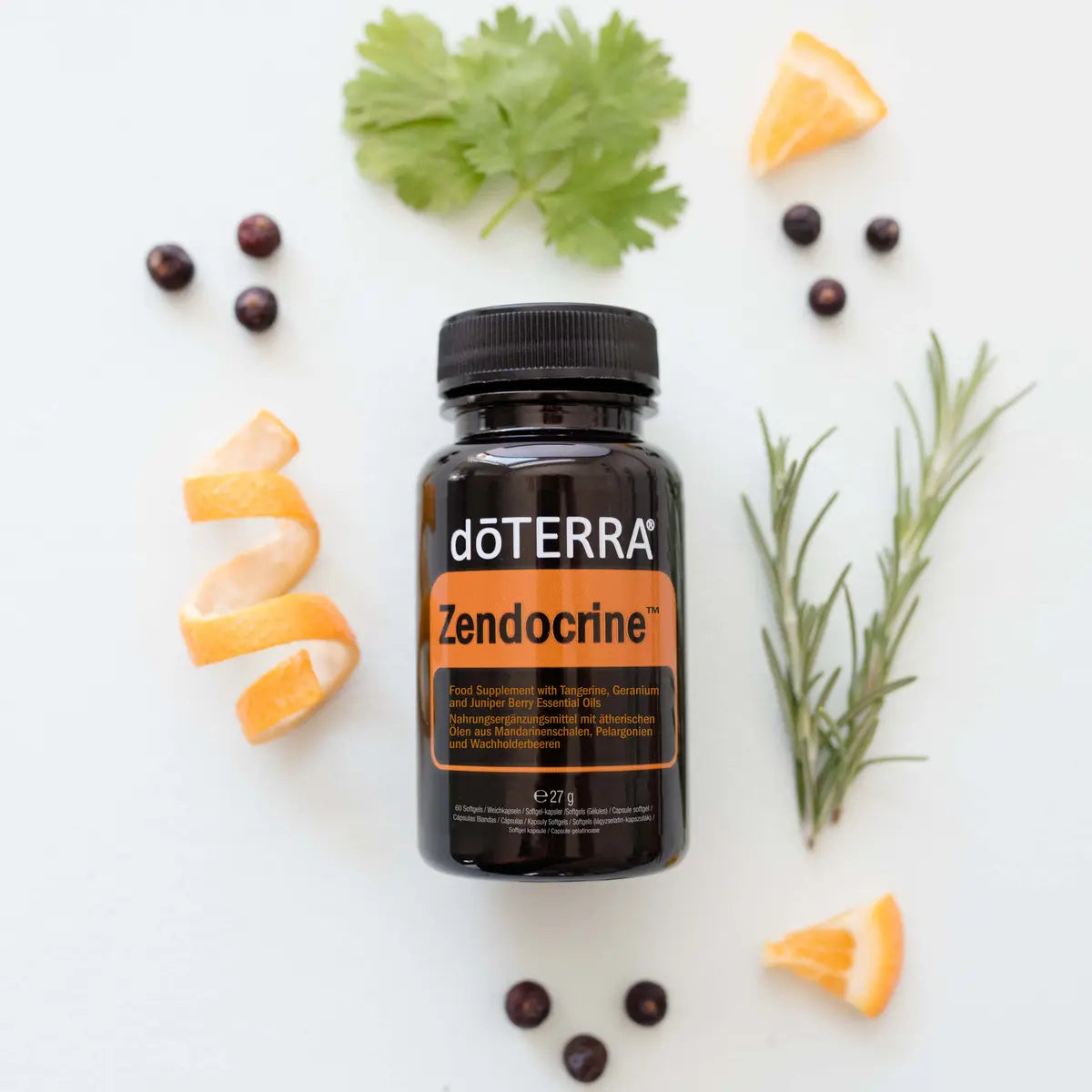 Botánicas de mandarina, enebro y romero junto a Zendocrine Softgels dōTERRA visto desde arriba